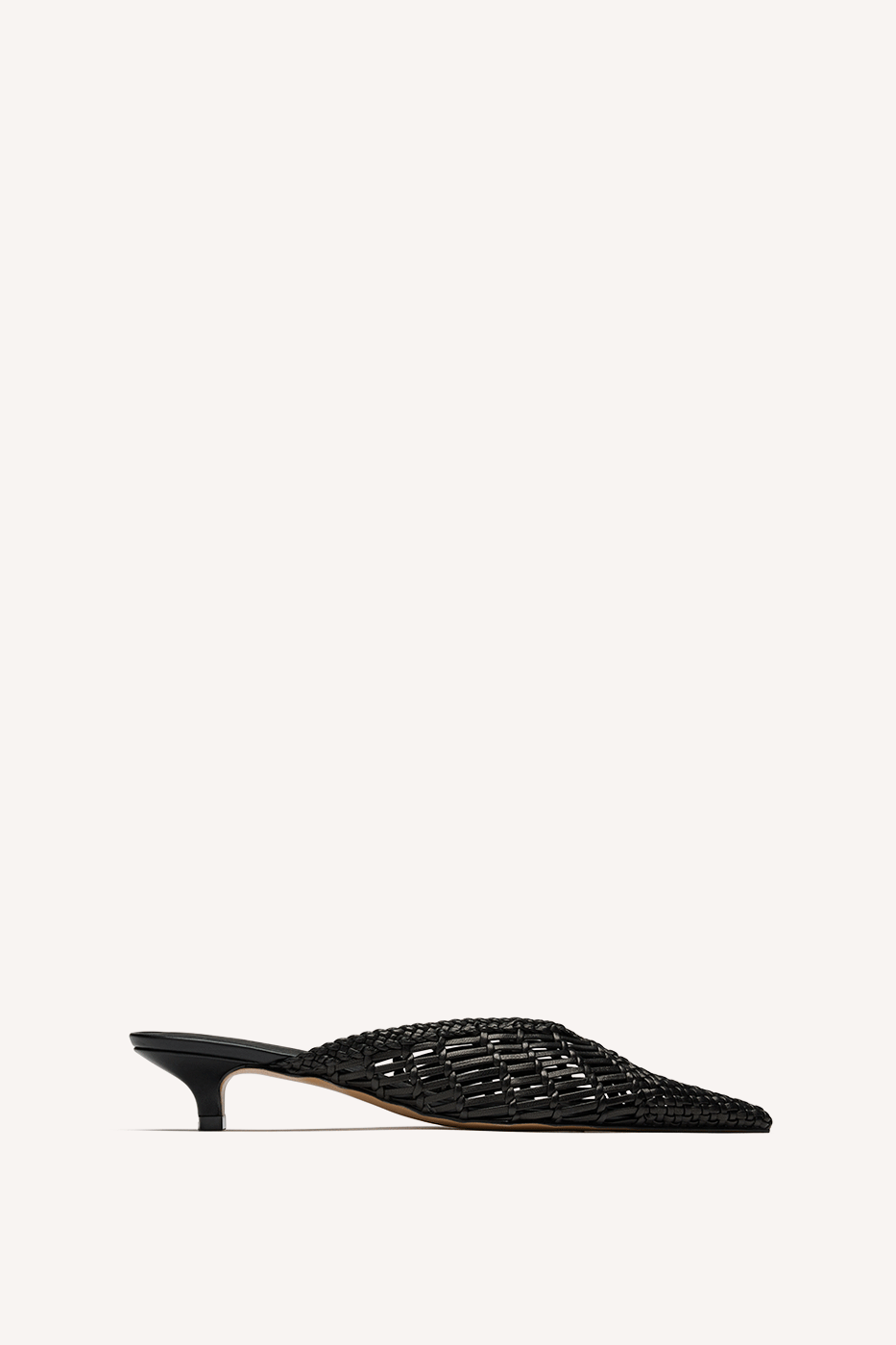 Nelson Made black woven mule with a pointed toe and kitten heel, shown in profile against a solid off-white background.