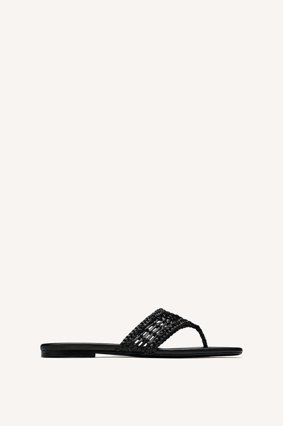Nelson Made black woven thong sandal with a flat sole, shown in profile against a solid off-white background.